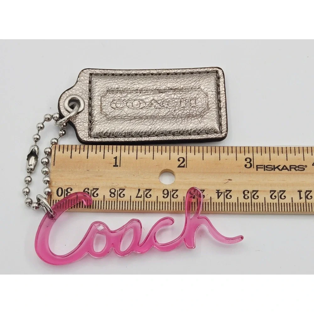 Coach POPPY Metallic Silver Leather Hangtag Pink Acrylic Script Logo Bag Charm